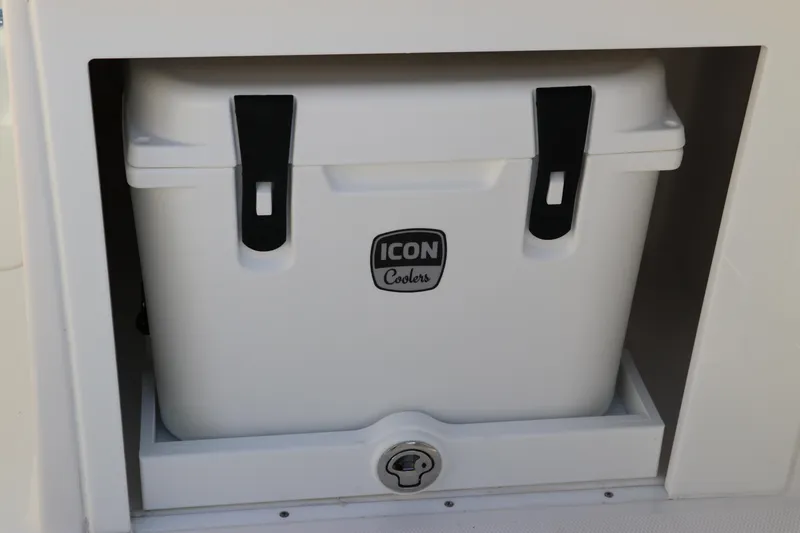 Slide: The Image of 2025 Edgewater 248 CX boat interior with beige seating and control panel. - 14