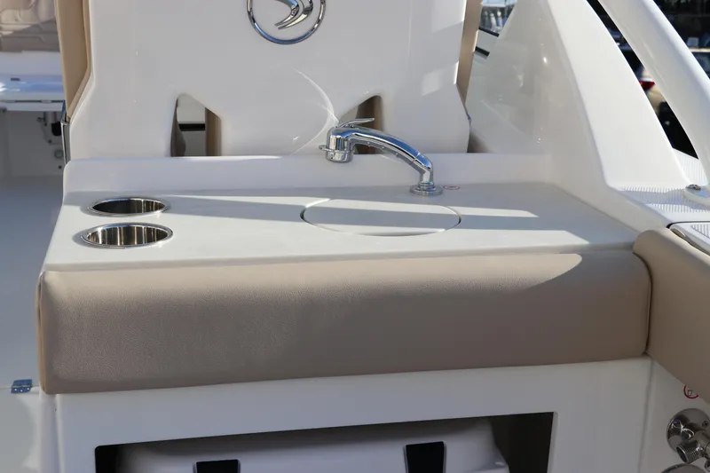 Slide: The Image of White Icon cooler in Edgewater 248 CX boat compartment, 2025 model. - 15