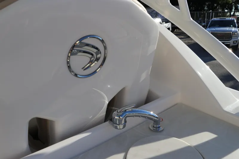 Slide: The Image of Edgewater 248 CX 2025 boat sink and cup holders on deck. - 17