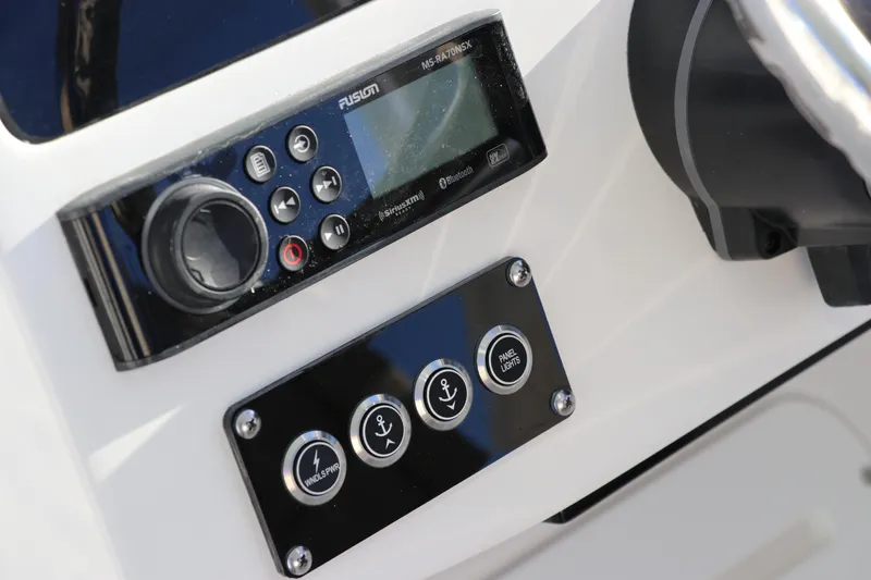 Slide: The Image of Edgewater 248 CX 2025 boat throttle control with chrome and black finish. - 26