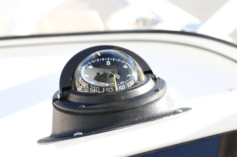 Slide: The Image of Control panel of 2025 Edgewater 248 CX boat with audio system and buttons. - 27