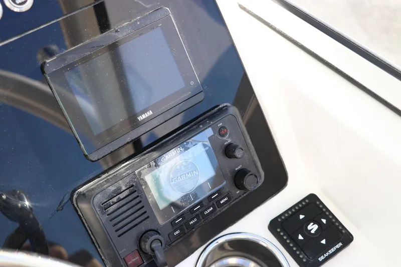 Slide: The Image of Compass on 2025 Edgewater 248 CX boat dashboard, close-up view. - 28