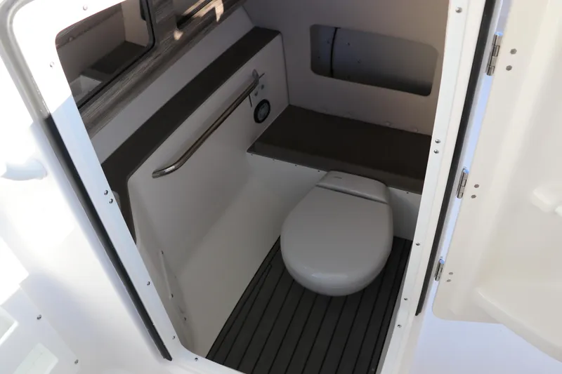 Slide: The Image of Edgewater 248 CX 2025 boat interior sink with faucet and handrail. - 33