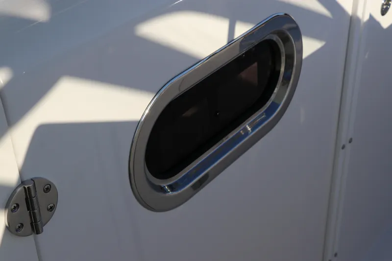 Slide: The Image of 2025 Edgewater 248 CX boat interior with compact marine toilet. - 34