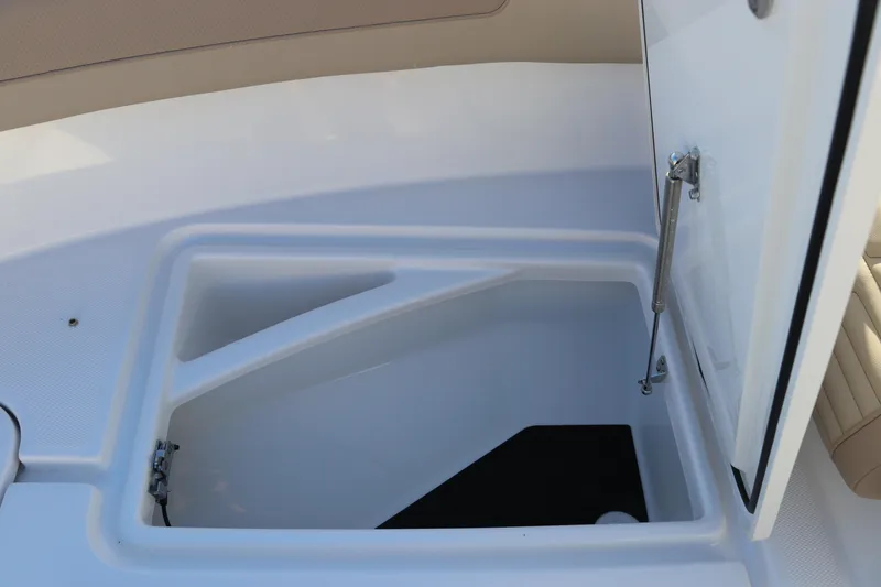 Slide: The Image of 2025 Edgewater 248 CX boat interior with spacious deck and seating. - 40