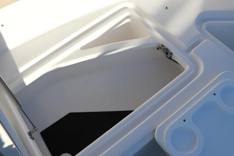 Slide: The Image of 2025 Edgewater 248 CX boat storage compartment with open hatch. - 41