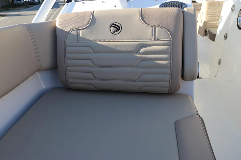 Slide: The Image of 2025 Edgewater 248 CX boat interior with beige seating and modern design. - 46