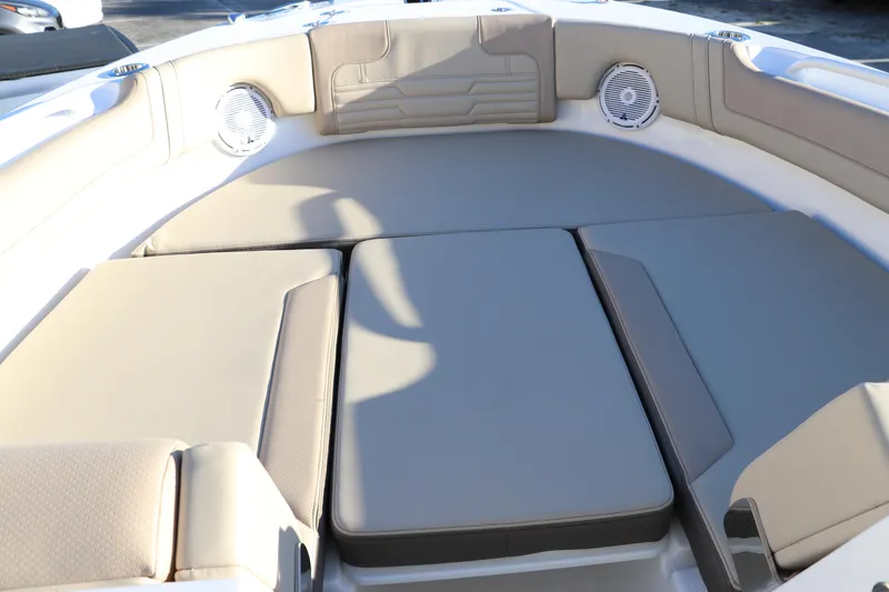 Slide: The Image of 2025 Edgewater 248 CX boat seat with beige upholstery and logo detail. - 47