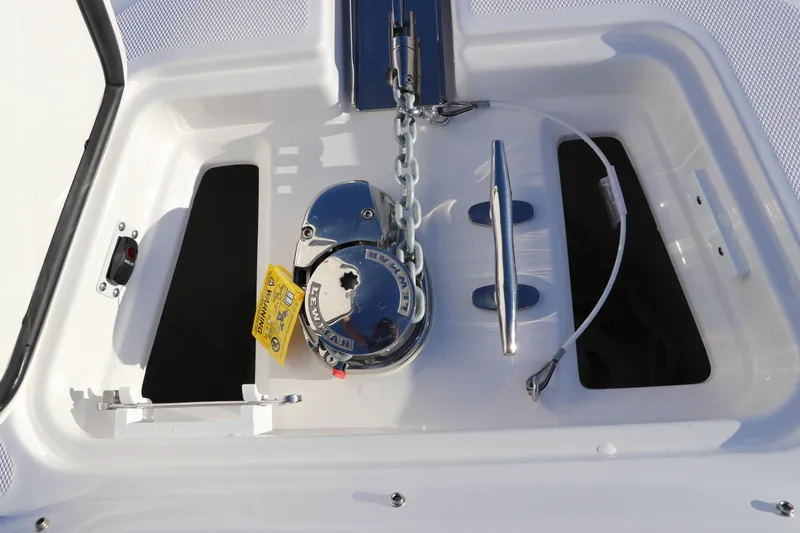 Slide: The Image of Anchor compartment of 2025 Edgewater 248 CX boat with chain and cleat. - 50