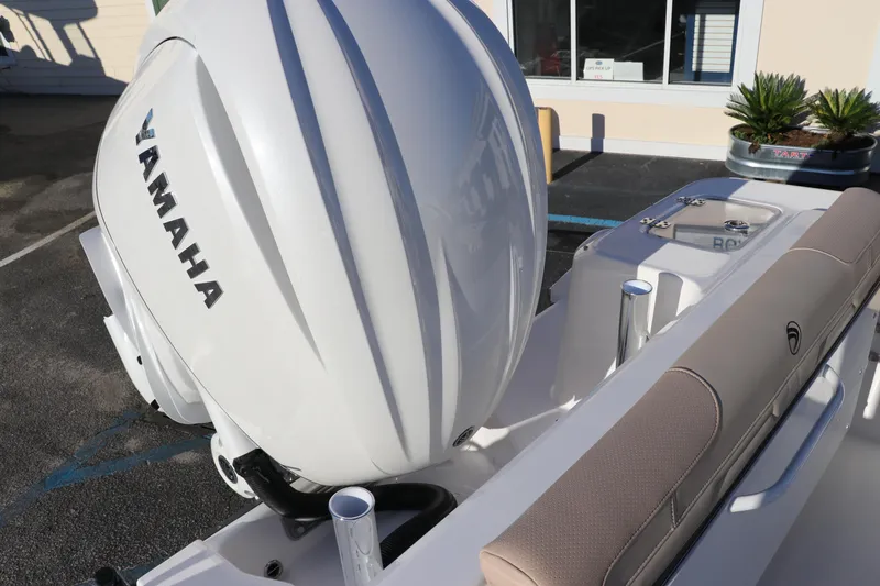Slide: The Image of 2025 Edgewater 248 CX boat with Yamaha outboard motor on trailer. - 7