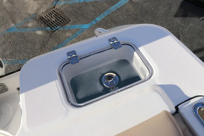 Slide: The Image of Edgewater 248 CX 2025 boat with Yamaha outboard motor, docked in sunlight. - 8