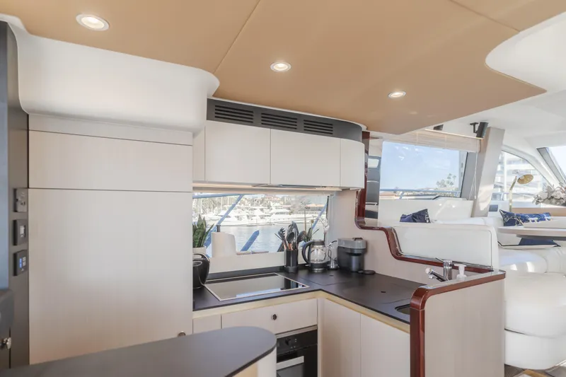 Slide: The Image of Luxurious interior of 2022 Azimut 55 Fly yacht with modern kitchen design. - 14