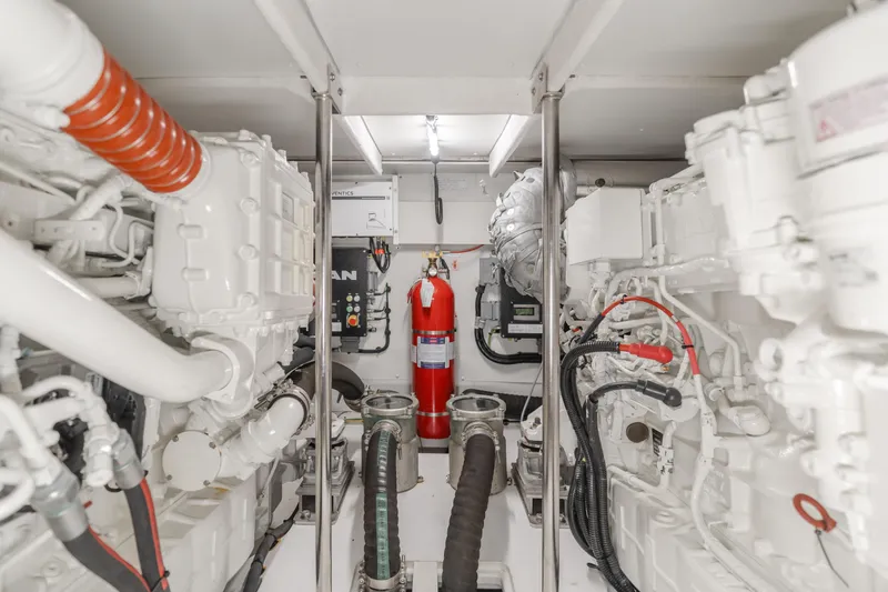 Slide: The Image of Engine room of 2022 Azimut 55 Fly yacht with fire extinguisher and machinery. - 25