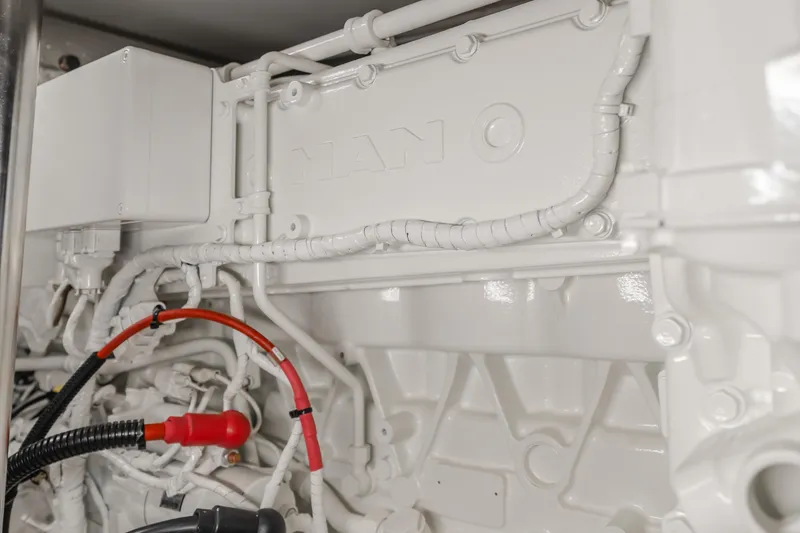 Slide: The Image of Engine compartment of 2022 Azimut 55 Fly yacht, featuring detailed mechanical components. - 26