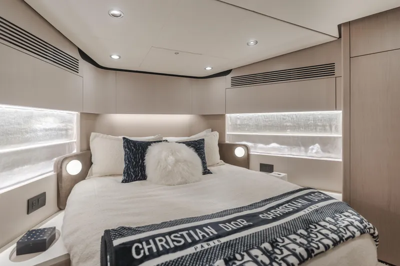 Slide: The Image of Luxurious bedroom interior of 2022 Azimut 55 Fly yacht with elegant bedding. - 28