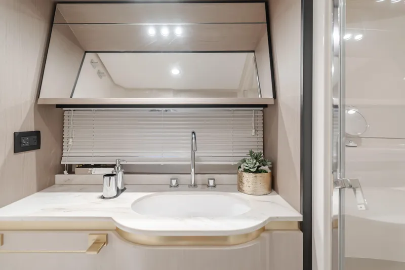 Slide: The Image of Luxurious bathroom interior of 2022 Azimut 55 Fly yacht with modern sink and mirror. - 35