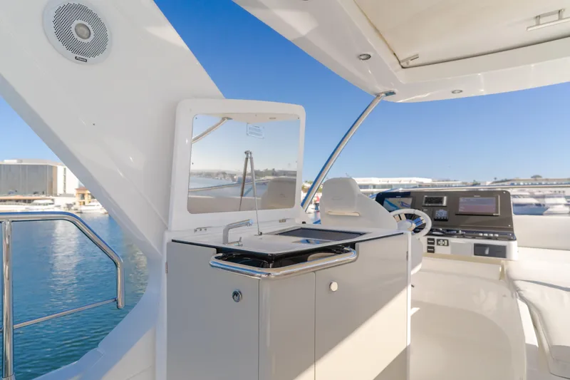 Slide: The Image of Luxurious 2022 Azimut 55 Fly yacht interior with modern helm and sleek design. - 46