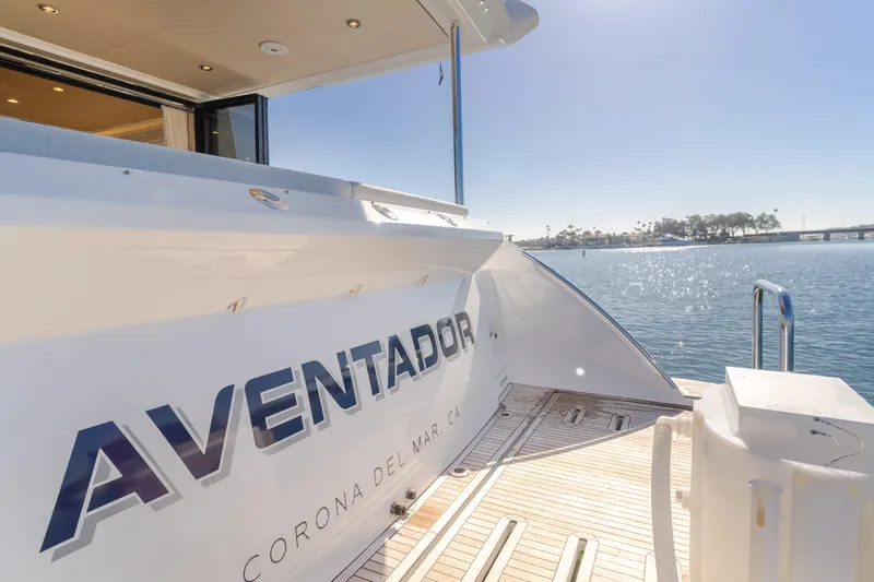 Slide: The Image of Azimut 55 Fly 2022 yacht docked, featuring "Aventador" name, sunny waterfront view. - 49