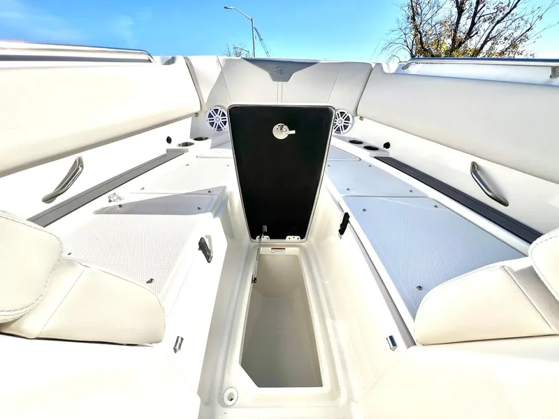 Slide: The Image of 2025 Sailfish 276 DC boat interior with white seating and storage compartments. - 11