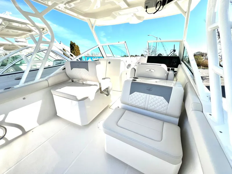 Slide: The Image of 2025 Sailfish 276 DC boat interior with modern seating and helm. - 16