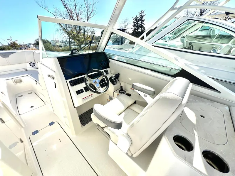 Slide: The Image of 2025 Sailfish 276 DC boat interior with modern helm and seating. - 17