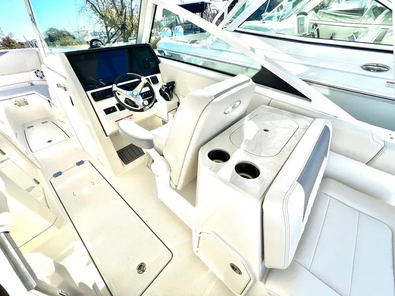 Slide: The Image of 2025 Sailfish 276 DC boat interior with modern helm and seating. - 31