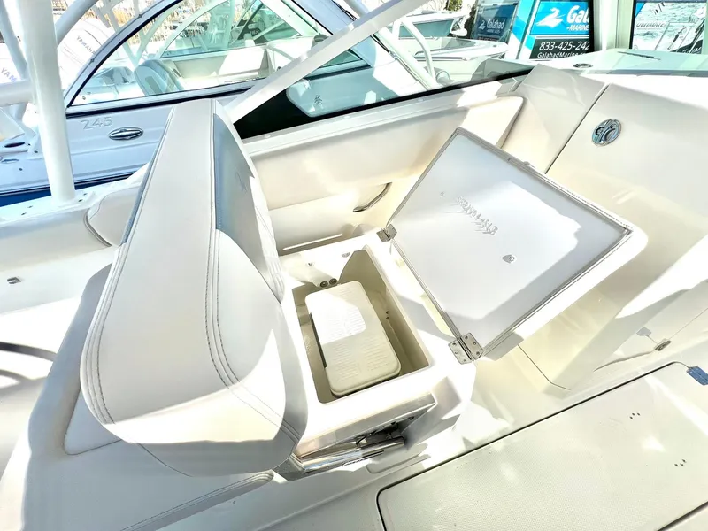 Slide: The Image of 2025 Sailfish 276 DC boat interior with open storage compartment. - 33