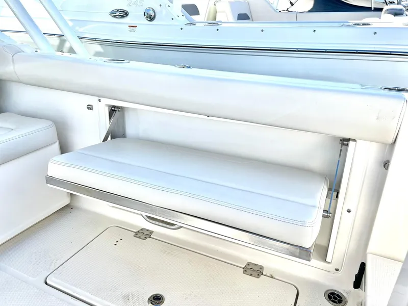 Slide: The Image of 2025 Sailfish 276 DC boat interior with white cushioned seating. - 35