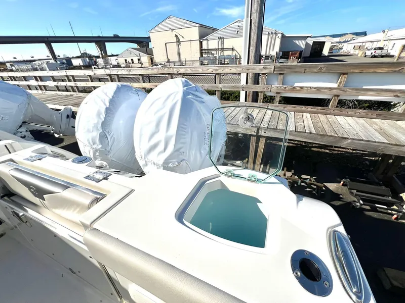 Slide: The Image of 2025 Sailfish 276 DC boat with covered engines and sleek design. - 42