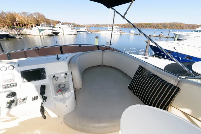 Slide: The Image of Azimut 50 Flybridge 2005 yacht interior with seating area and control panel. - 12