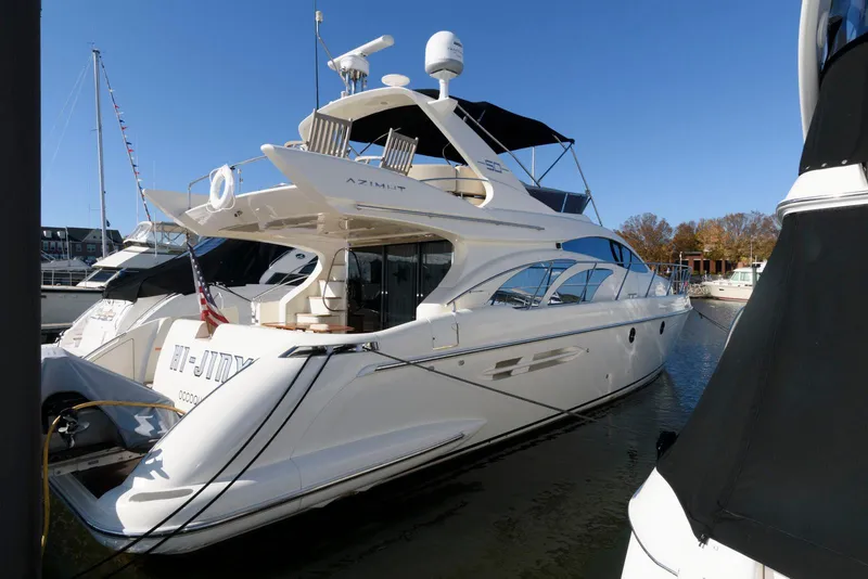 Slide: The Image of Azimut 50 Flybridge 2005 yacht docked in marina, sleek design, sunny day. - 2