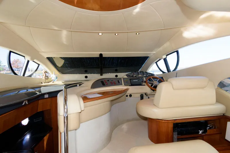 Slide: The Image of Luxurious 2005 Azimut 50 Flybridge yacht interior with elegant helm and seating area. - 22