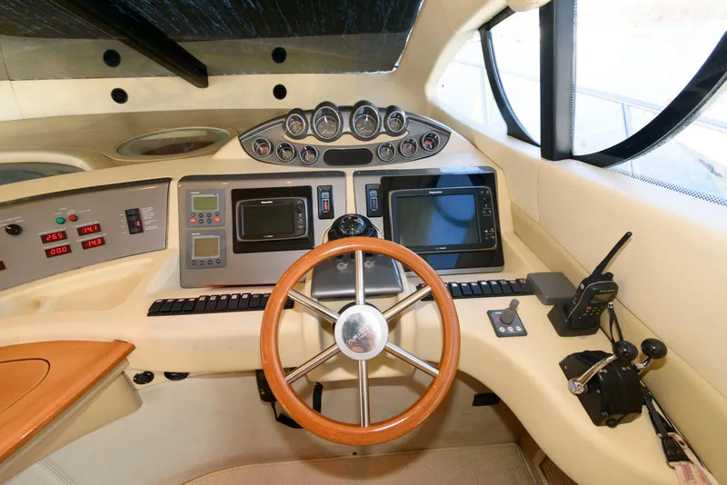 Slide: The Image of Cockpit of 2005 Azimut 50 Flybridge yacht with steering wheel and navigation instruments. - 24