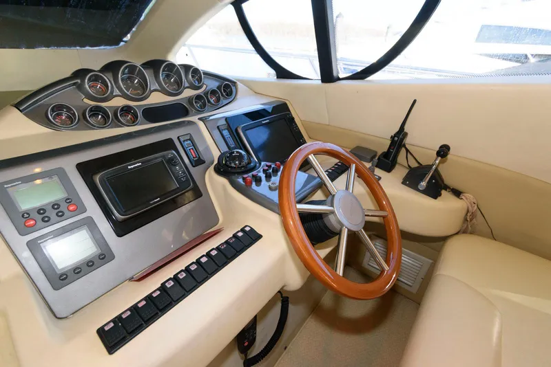 Slide: The Image of Cockpit of 2005 Azimut 50 Flybridge yacht with steering wheel and navigation instruments. - 25