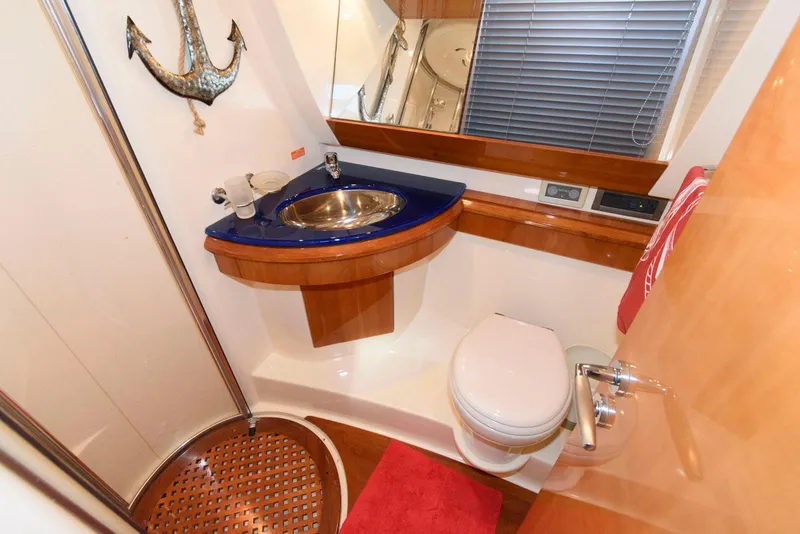 Slide: The Image of Luxurious 2005 Azimut 50 Flybridge yacht bathroom with modern fixtures and nautical decor. - 30