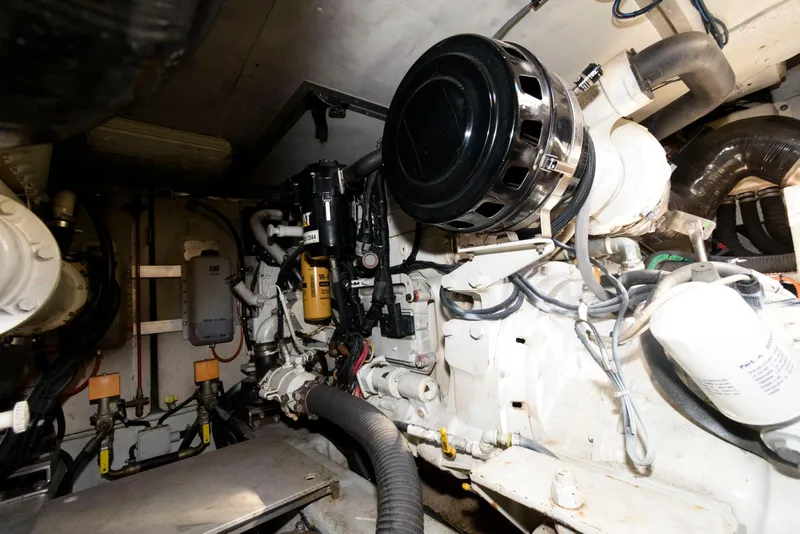 Slide: The Image of Engine room of 2005 Azimut 50 Flybridge yacht, showcasing mechanical components. - 37