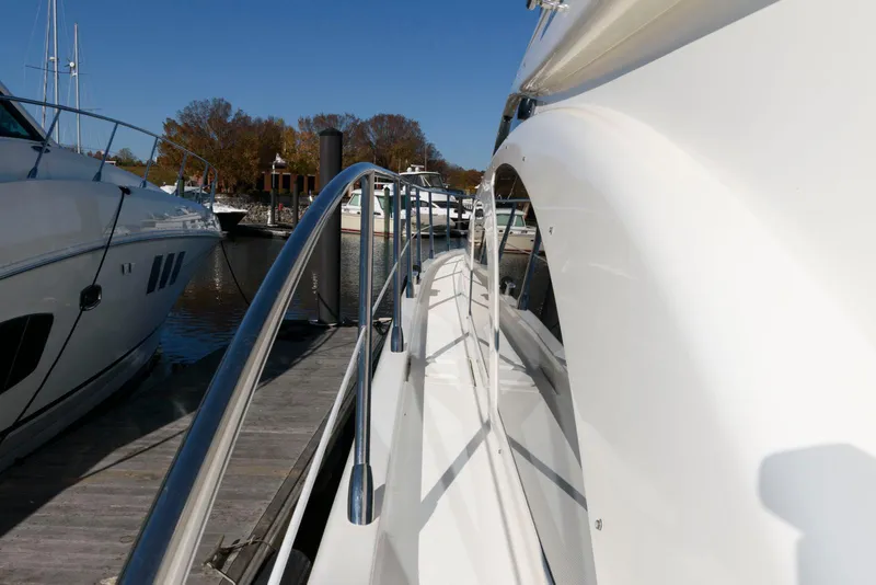 Slide: The Image of 2005 Azimut 50 Flybridge yacht docked at marina, side view. - 6