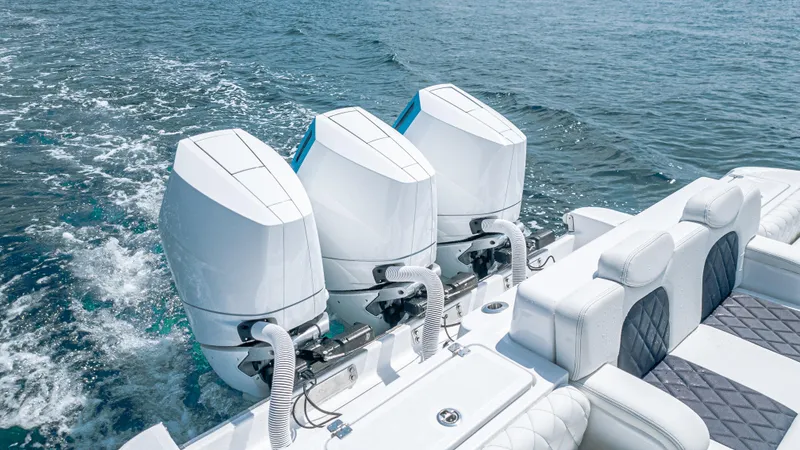 Slide: The Image of 2025 HCB 39 Speciale boat with triple outboard engines on the ocean. - 10