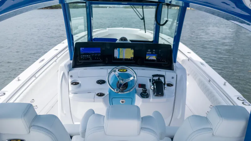 Slide: The Image of 2025 HCB 39 Speciale boat cockpit with advanced navigation system and luxurious seating. - 16