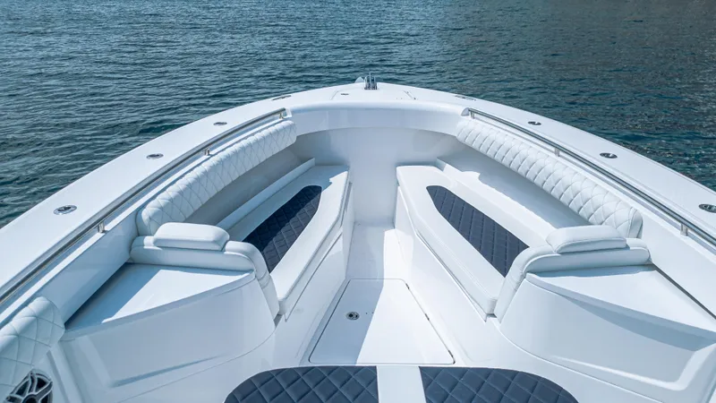 Slide: The Image of 2025 HCB 39 Speciale boat interior with luxurious seating on calm water. - 18