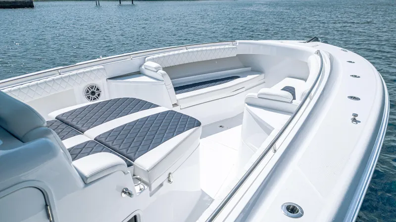 Slide: The Image of 2025 HCB 39 Speciale boat interior with luxurious seating and sleek design on the water. - 19
