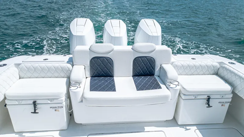 Slide: The Image of 2025 HCB 39 Speciale boat interior with luxurious seating and powerful engines on the water. - 7