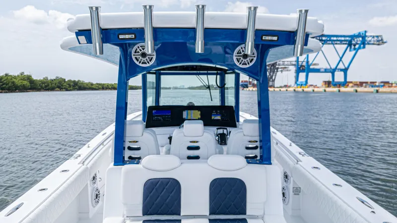Slide: The Image of 2025 HCB 39 Speciale boat interior with blue accents and advanced navigation system. - 9