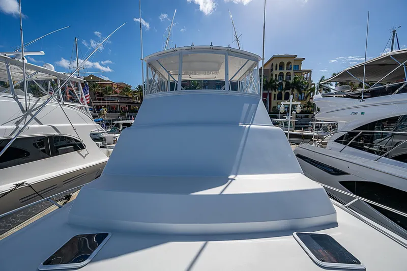 Slide: The Image of 1999 Post 50 Convertible yacht docked at marina under clear blue sky. - 18