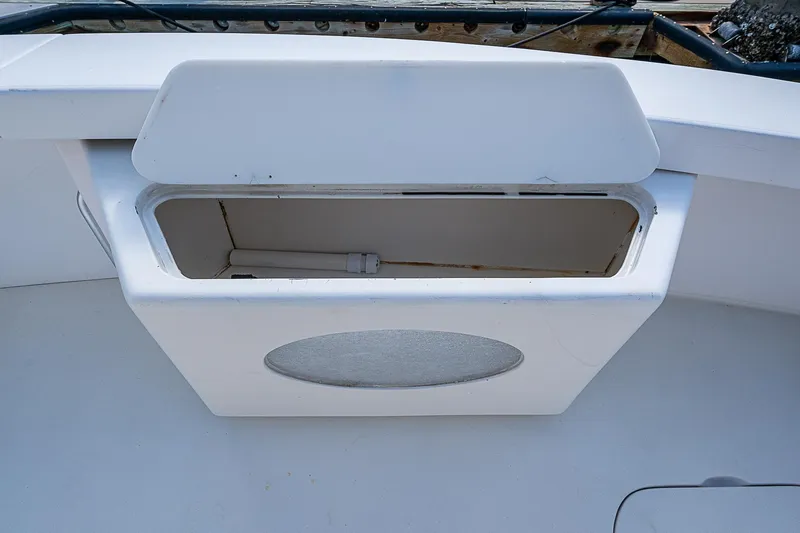 Slide: The Image of Open storage compartment on a 1999 Post 50 Convertible boat. - 21