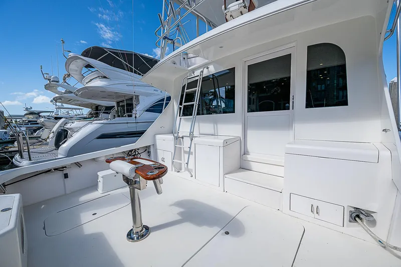 Slide: The Image of 1999 Post 50 Convertible yacht with spacious deck and modern design in marina. - 22