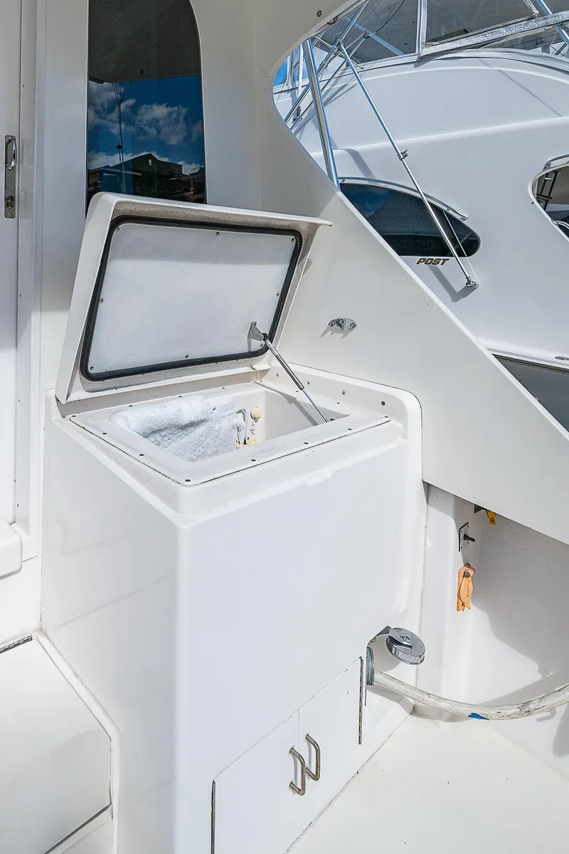 Slide: The Image of 1999 Post 50 Convertible yacht with open storage compartment on deck. - 24