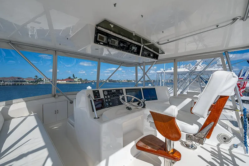 Slide: The Image of Interior of 1999 Post 50 Convertible yacht with helm and navigation equipment. - 32