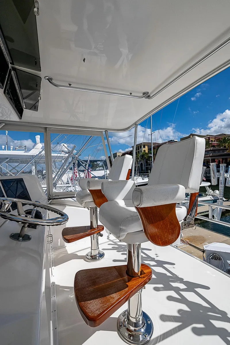 Slide: The Image of Luxury yacht helm with white leather seats, Post 50 Convertible, 1999 model. - 36