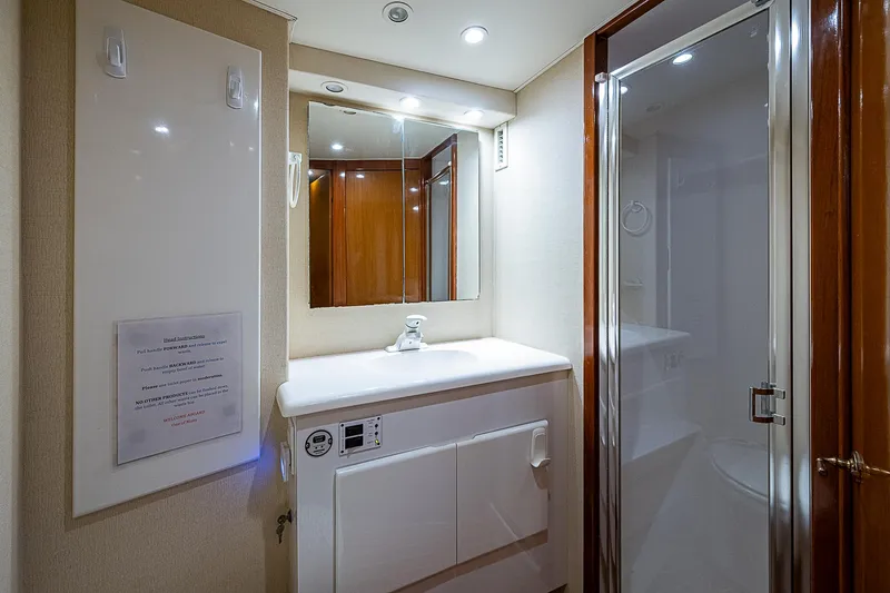 Slide: The Image of Luxurious bathroom in 1999 Post 50 Convertible yacht with modern fixtures and shower. - 41